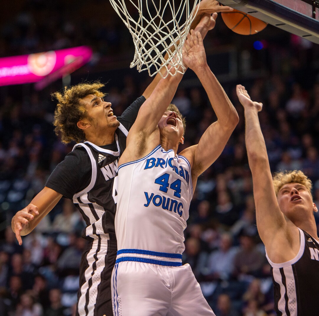 (Rick Egan  |  The Salt Lake Tribune)        Nevada Wolf Pack forward K.J. Hymes (42) blacks a shot by Brigham Young Cougars guard Connor Harding (44), in basketball action between the Brigham Young Cougars and the Nevada Wolf Pack, at the Marriott Center, in Provo, Saturday, December 10, 2019.