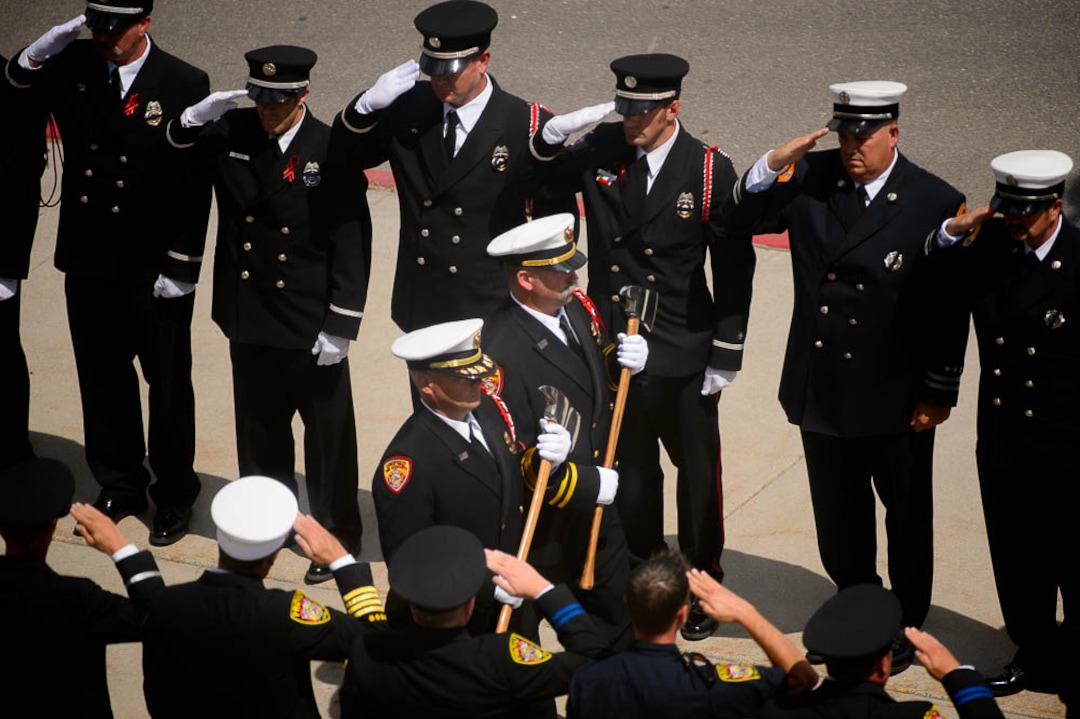 (Trent Nelson | The Salt Lake Tribune)  Funeral services for Battalion Chief Matthew Burchett at the Maverik Center in West Valley City, Monday Aug. 20, 2018.