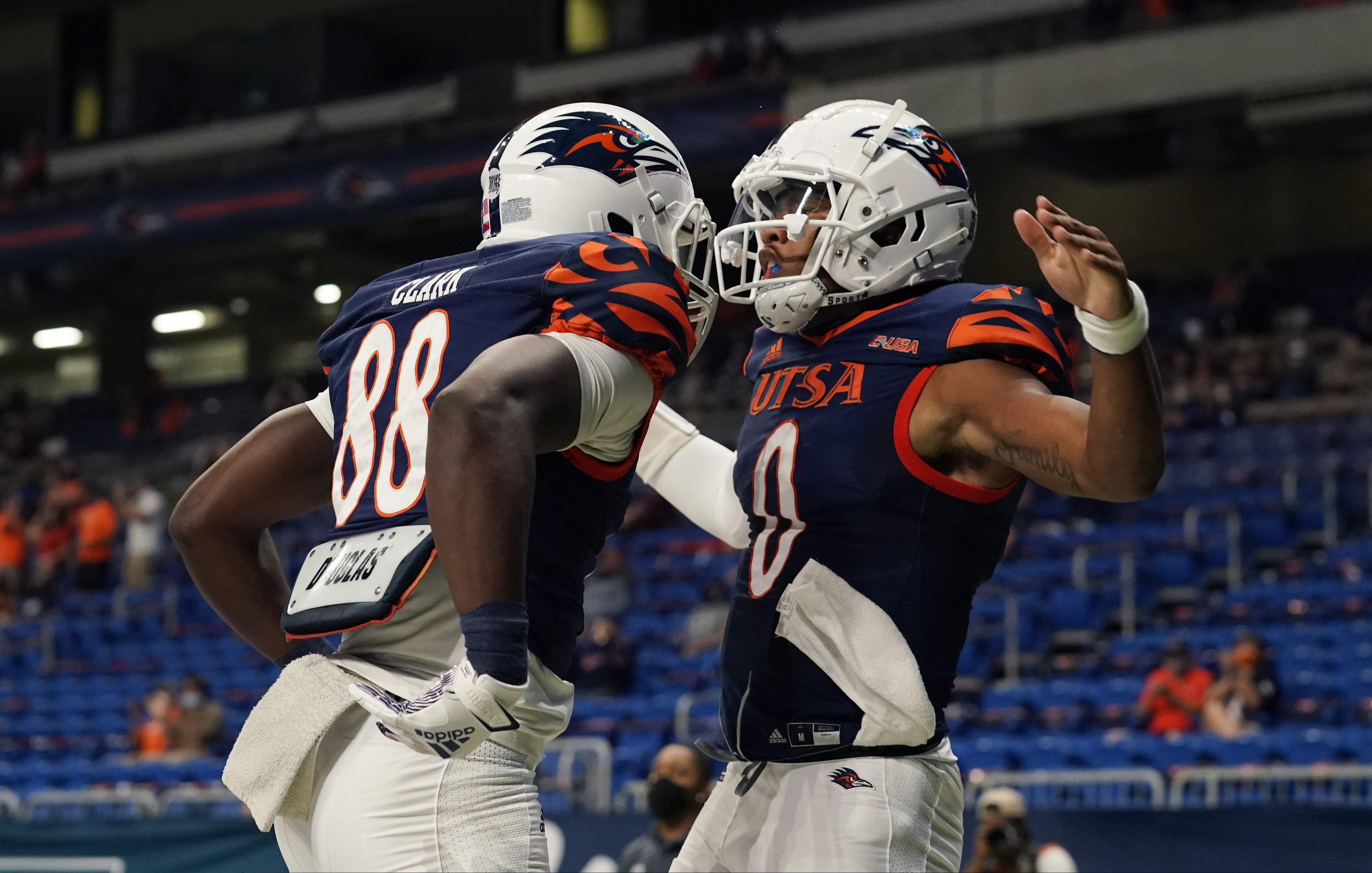 UTSA quarterback Frank Harris (0) celebrates with teammate De'Corian Clark (88) after running for a touchdown against Stephen F. Austin during the first half of an NCAA college football game, Saturday, Sept. 19, 2020, in San Antonio. (AP Photo/Eric Gay)
