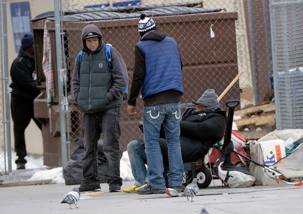 (Al Hartmann | The Salt Lake Tribune) Men congregate outside the Road Home shelter on 400 West and 250 South in Salt Lake City on Monday, Feb. 26, 2018.