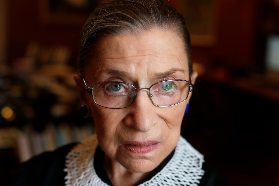 FILE - In this July 24, 2013, file photo Associate Justice Ruth Bader Ginsburg poses for a photo in her chambers at the Supreme Court in Washington, before an interview with the Associated Press. Ginsburg will officiate at a same-sex wedding this weekend in what is believed to be a first for a member of the nations highest court. Ginsburg will officiate Saturday, aug. 31, 2013, at the marriage of Kennedy Center President Michael Kaiser and John Roberts, a government economist. Kaiser told The Associated Press he asked Ginsburg to officiate because she is a longtime friend.  (AP Photo/Charles Dharapak, File)