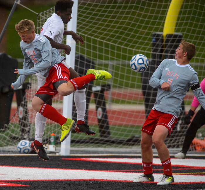 (Steve Griffin  |  The Salt Lake Tribune) Delta's Spencer Sanders, left, and Sam Clark, right, battle Judge's Ferdinand Bambabate for the ball during the Class 3A boys' soccer state semifinal at Alta High School in Sandy Friday May 11, 2018.