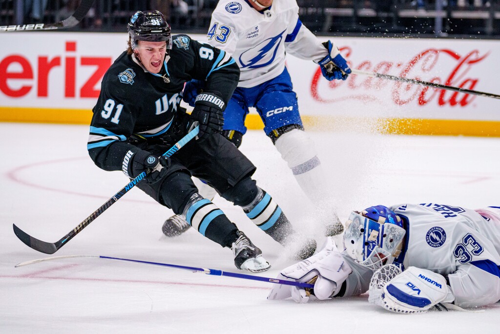(Trent Nelson | The Salt Lake Tribune) Utah Hockey Club right wing Josh Doan (91) comes to a stop as Tampa Bay Lightning goaltender Brandon Halverson knocks the puck away as Utah Hockey Club hosts the Tampa Bay Lightning, NHL hockey at the Delta Center in Salt Lake City on Saturday, March 22, 2025.