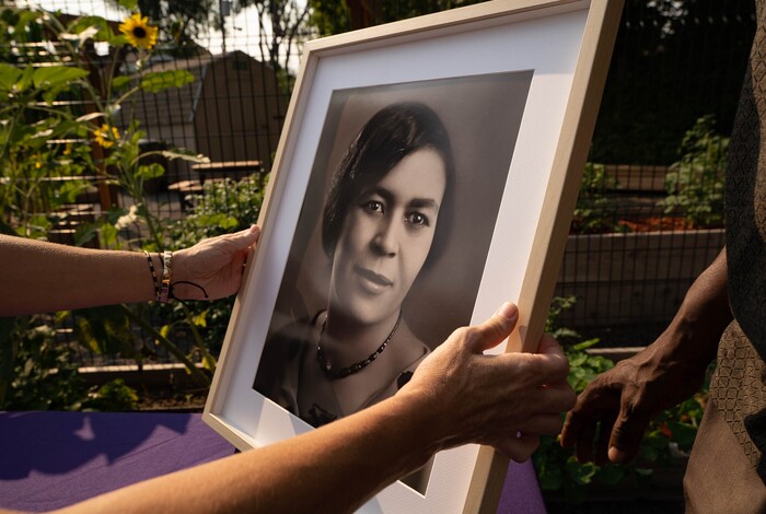(Francisco Kjolseth | The Salt Lake Tribune) A photograph of Mignon Barker Richmond, the first African-American woman to graduate from college in Utah, is put on display on Wednesday, Aug. 4, 2021, as Salt Lake City unveils its newest community garden at Richmond Park, named in her honor.