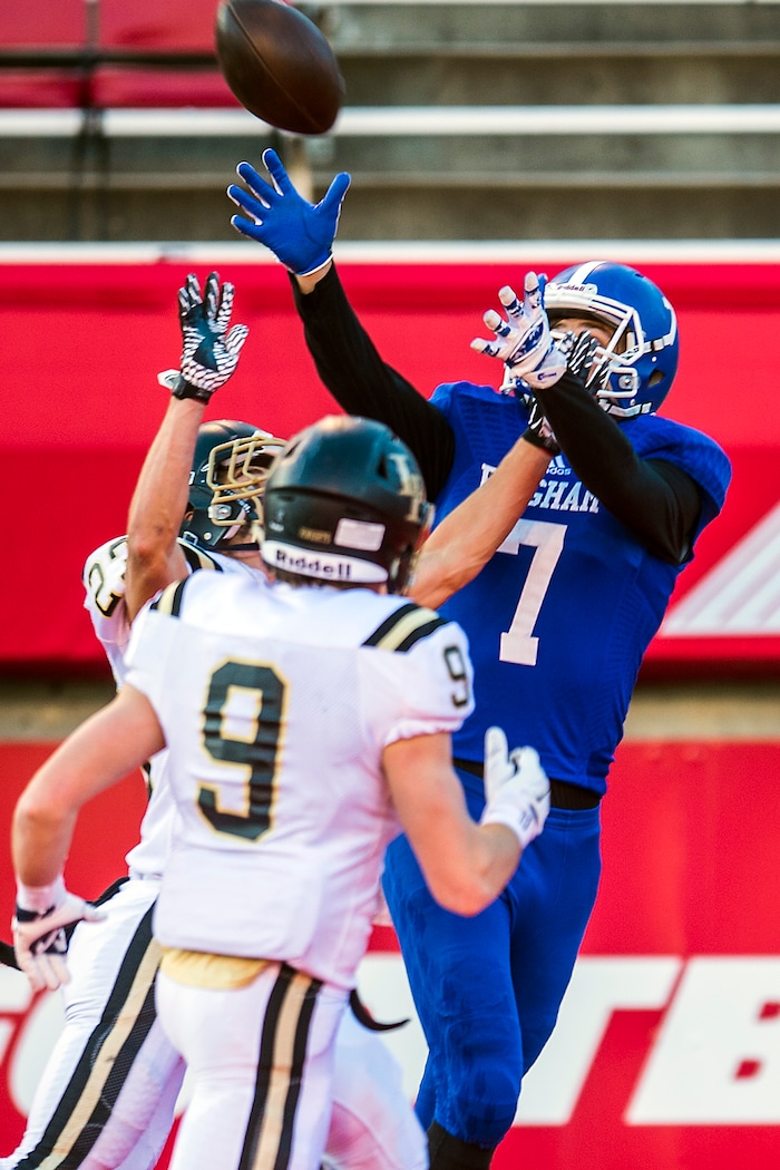 Chris Detrick | The Salt Lake Tribune
Bingham's Brayden Cosper (7) makes a touchdown catch past Lone Peak's Eli Norman (9) and Lone Peak's Tanner Hansen (23) during the 5A football championship at Rice-Eccles Stadium Friday November 18, 2016.