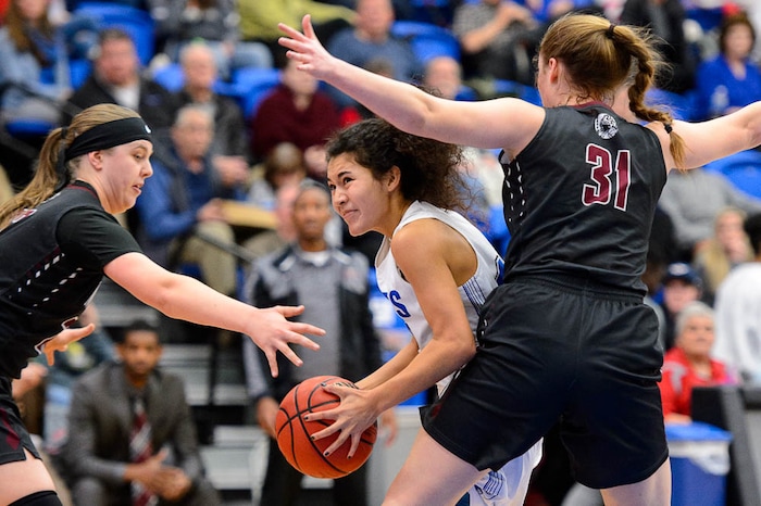 (Trent Nelson | The Salt Lake Tribune)  Bingham's Ameleya Angilau (12) drives on Northridge's Lydia Mashburn (22) and Northridge's Jessica Petersen (31) as Bingham faces Northridge in the 6A High School Girls' Basketball Tournament at SLCC in Taylorsville, Thursday Feb. 22, 2018.