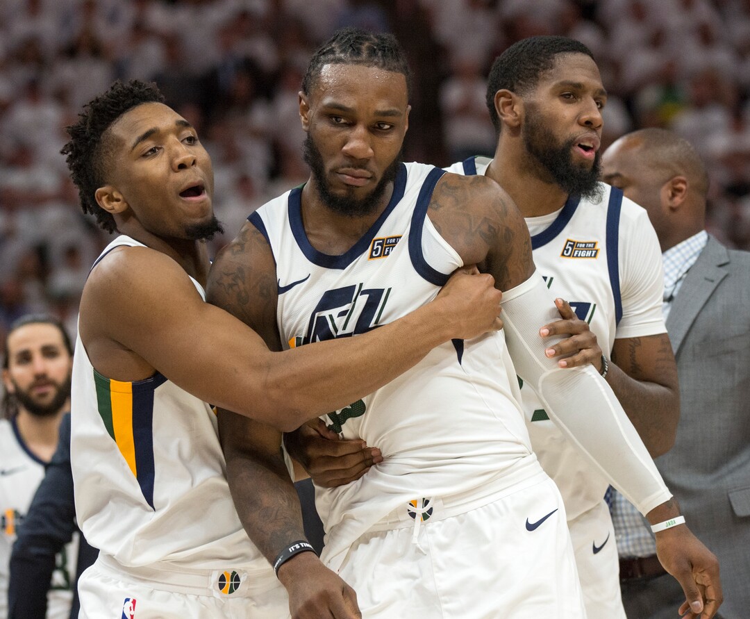 (Rick Egan  |  The Salt Lake Tribune)     Donovan Mitchell (45) drags Utah Jazz forward Jae Crowder (99) out of a shoving match, in NBA action in game 4, NBA playoff action between Utah Jazz and Oklahoma City Thunder, in Salt Lake City, Monday April 23, 2018.
