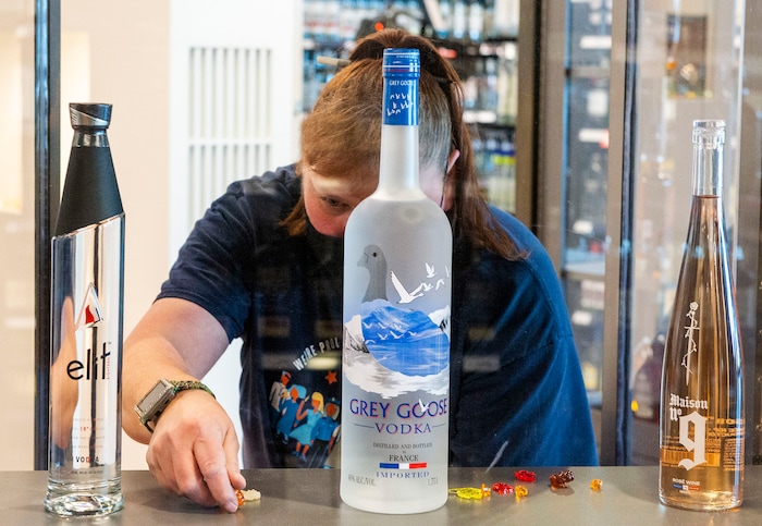 (Rick Egan | The Salt Lake Tribune)  Kym Giles works on a display in the premium products show room at the new state liquor and wine store in Saratoga Springs, on Monday, Nov. 16, 2020.