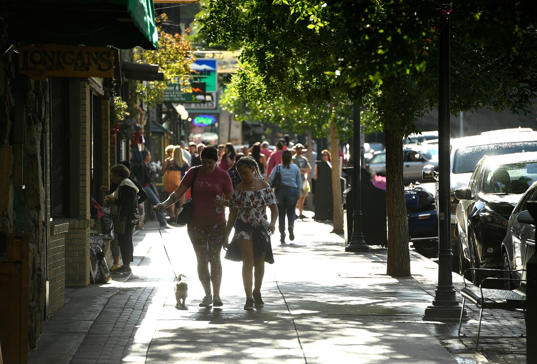 (Helen H. Richardson  |  The Denver Post) Tourists enjoy walking down West Elkhorn Ave on August 5, 2018, in Estes Park, Colorado. The popular town is overrun with tourists in the summer who come to visit and explore close nearby Rocky Mountain National Park.