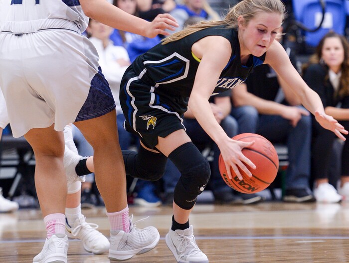 (Leah Hogsten  |  The Salt Lake Tribune)  Pleasant Grove's Kenna Sparks goes to the deck chasing a ball that got away from her.   Copper Hills High School girls' basketball team defeated Pleasant Grove High School 66-25 during their Class 6A girls' basketball playoff opener at Salt Lake Community College Tuesday, Feb. 20, 2018. 