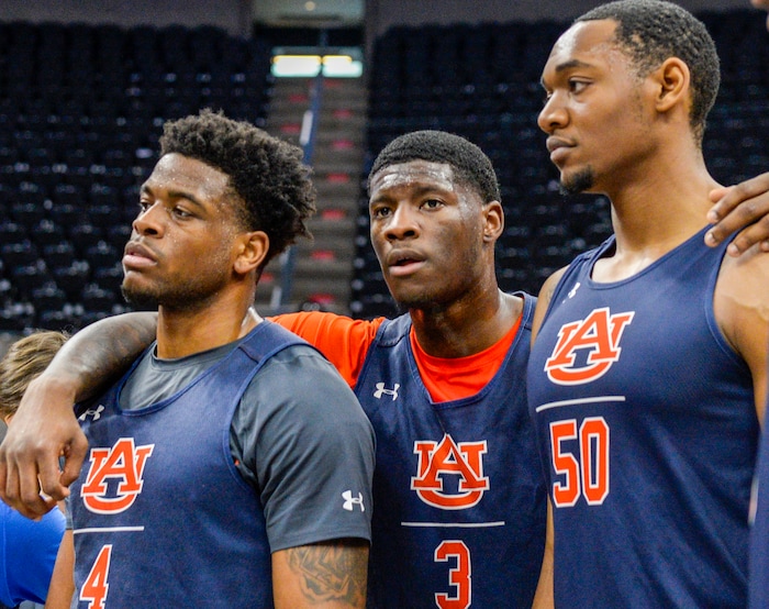 Leah Hogsten  |  The Salt Lake Tribune  l-r Auburn's Malik Dunbar, Danjel Purifoy and Austin Wiley huddle after practice Wednesday at the 2019 NCAA Division I Men's Basketball Championship, March 20, 2019 in preparation for their first round game against the Northeastern Huskies on Thursday.