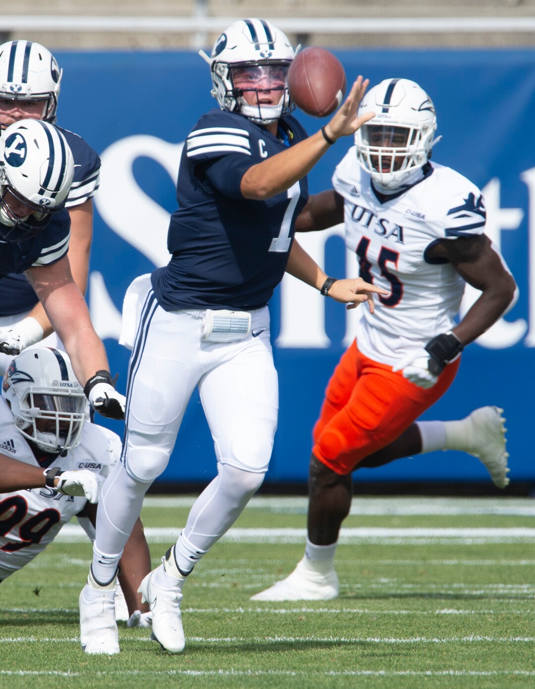 (Rick Egan  |  The Salt Lake Tribune)   Brigham Young Cougars quarterback Zach Wilson (1)  tosses a shovel pass to Brigham Young Cougars tight end Masen Wake (13), in football action between the Brigham Young Cougars and the UTSA Roadrunners, at Lavell Edwards stadium, Saturday, Oct. 10, 2020.