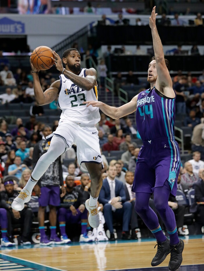 Utah Jazz's Royce O'Neale (23) looks to pass the ball as Charlotte Hornets' Frank Kaminsky (44) defends during the first half of an NBA basketball game in Charlotte, N.C., Friday, Jan. 12, 2018. (AP Photo/Chuck Burton)