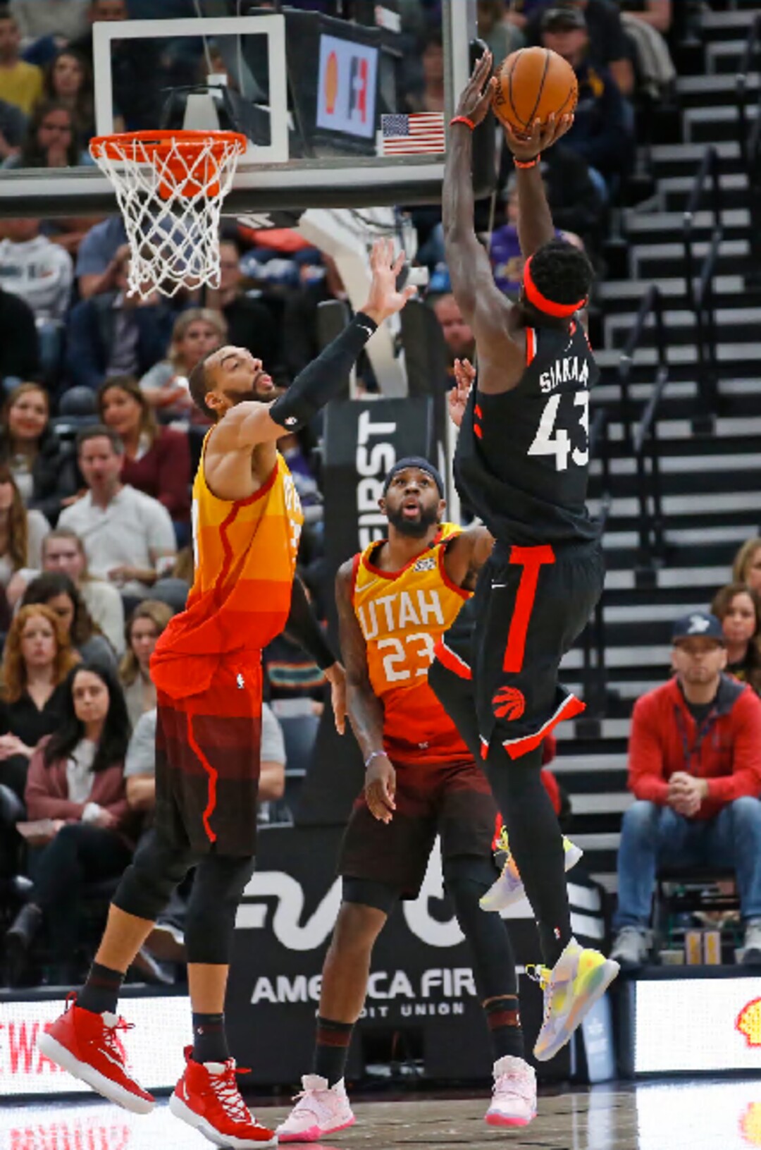 Toronto Raptors forward Pascal Siakam (43) shoots as Utah Jazz's Rudy Gobert, left, and Royce O'Neale (23) defend in the second half of an NBA basketball game, Monday, March 9, 2020, in Salt Lake City. (AP Photo/Rick Bowmer)