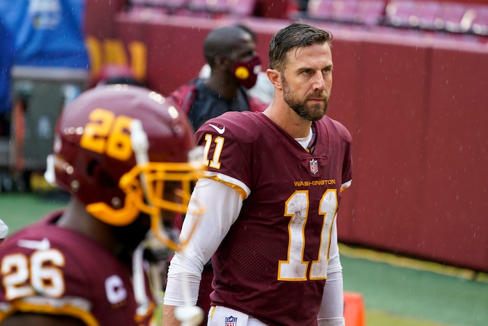 Washington Football Team's Alex Smith walks off the field after an NFL football game against the Los Angeles Rams Sunday, Oct. 11, 2020, in Landover, Md. The Rams won 30-10. (AP Photo/Steve Helber)