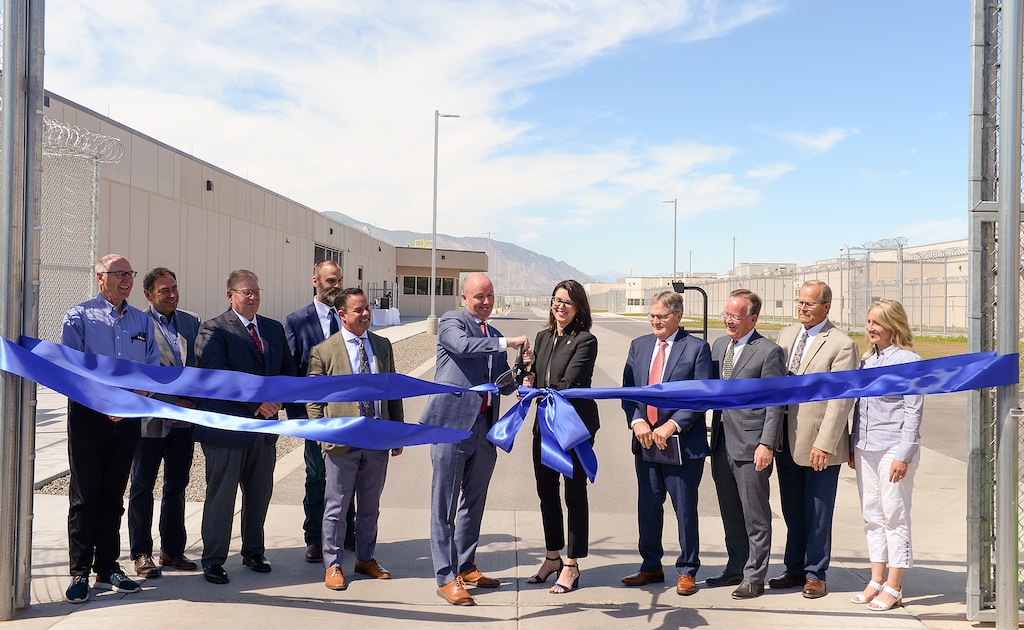 (Chris Samuels | The Salt Lake Tribune) Gov. Spencer Cox and Lt. Gov. Deidre Henderson cut a ribbon to open the Utah State Correctional Facility in Salt Lake City, Wednesday, June 22, 2022.