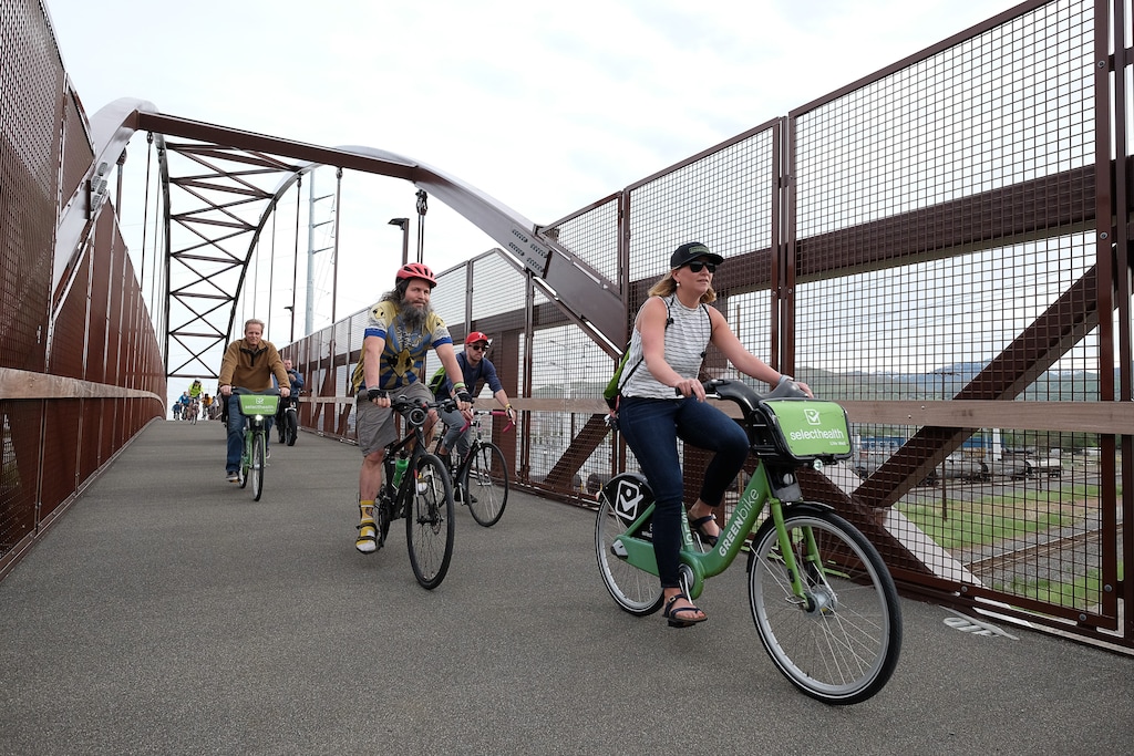 (Francisco Kjolseth | The Salt Lake Tribune) People join Salt Lake City Mayor Jackie Biskupski on Thursday, May 16, 2019, as part of the annual Mayor's Bike to Work Day. This year's ride began at the Northwest Recreation Center and ran primarily along the Jordan River Trail in an effort to show off the investments the city and others have made to the trail including the new 120-foot arch bridge that connects the north and south sides of the trail between 200 South and North Temple.