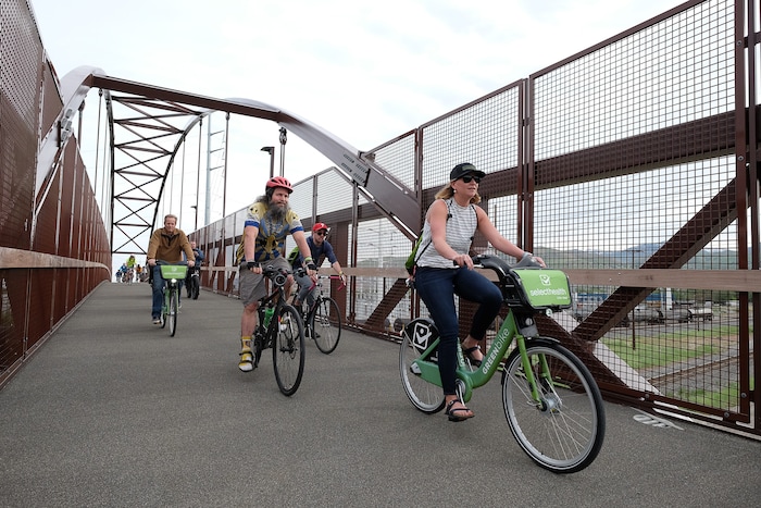 (Francisco Kjolseth | The Salt Lake Tribune) People join Salt Lake City Mayor Jackie Biskupski on Thursday, May 16, 2019, as part of the annual MayorÕs Bike to Work Day. This yearÕs ride began at the Northwest Recreation Center and ran primarily along the Jordan River Trail in an effort to show off the investments the city and others have made to the trail including the new 120-foot arch bridge that connects the north and south sides of the trail between 200 South and North Temple.