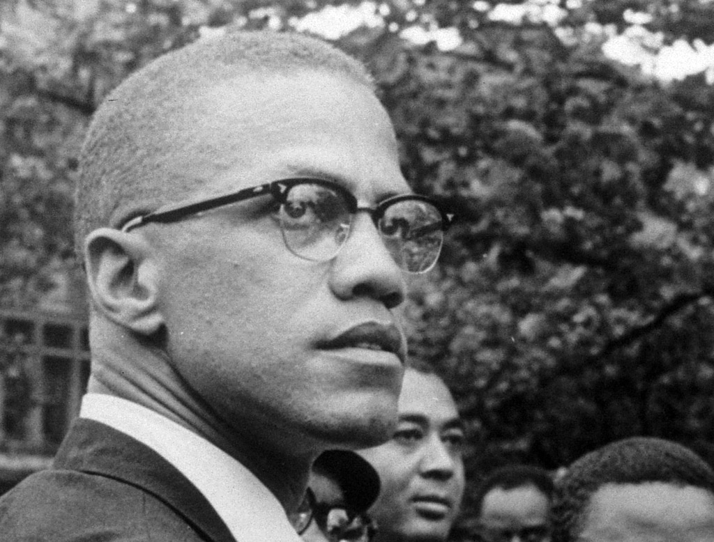 (Robert Haggins | AP file photo)

In this 1963 photo, Black Nationalist leader Malcolm X attends a rally at Lennox Avenue and 115th Street in the Harlem neighborhood of New York.