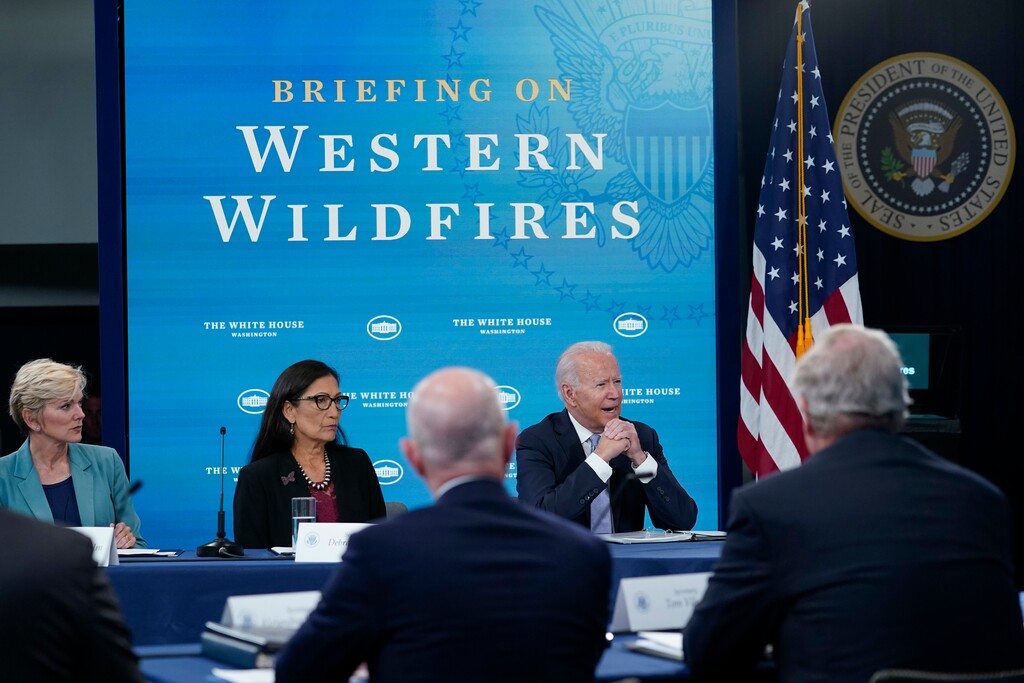 (Susan Walsh | AP) President Joe Biden, right, speaks during an event in the South Court Auditorium on the White House complex in Washington, Wednesday, June 30, 2021, with cabinet officials and governors from Western states to discuss drought and wildfires. Joining him is Energy Secretary Jennifer Granholm, left, and Interior Secretary Deb Haaland, center.