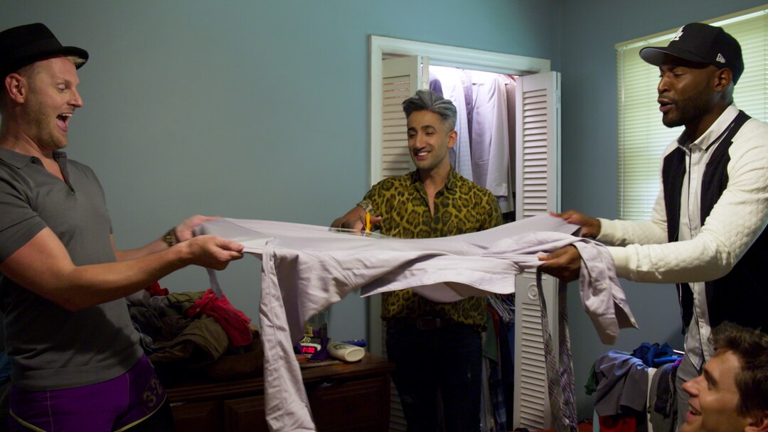 (Photo courtesy of Netflix) Bobby Berk (left) and Karamo Brown (right) help Tan France destroy a shirt in an episode of “Queer Eye.”