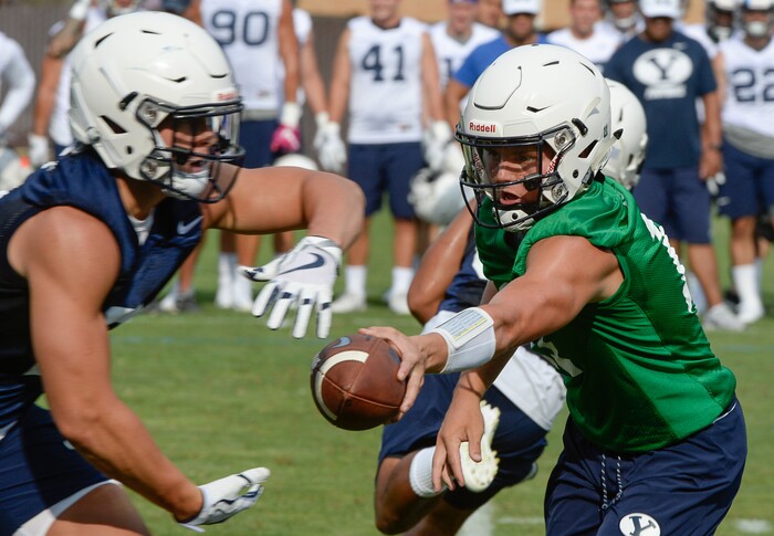 (Francisco Kjolseth  |  The Salt Lake Tribune)  BYU quarterback Zach Wilson runs through drills as the team opens preseason training camp on their practice field on Thursday, Aug. 2, 2018.