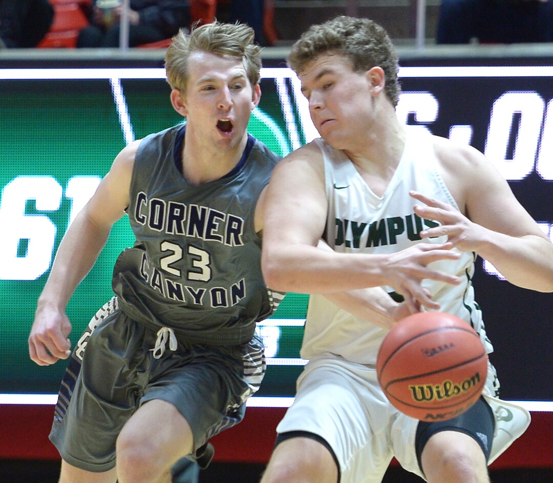 (Leah Hogsten  |  The Salt Lake Tribune) Corner Canyon's Blake Emery (23) tries to steal from Olympus' Harrison Creer (23). Olympus defeated Corner Canyon 76-49 to win the 5A High School BoysÕ Basketball Tournament Championship at the Jon M. Huntsman Center in Salt Lake City,  Saturday, March 3, 2018. 