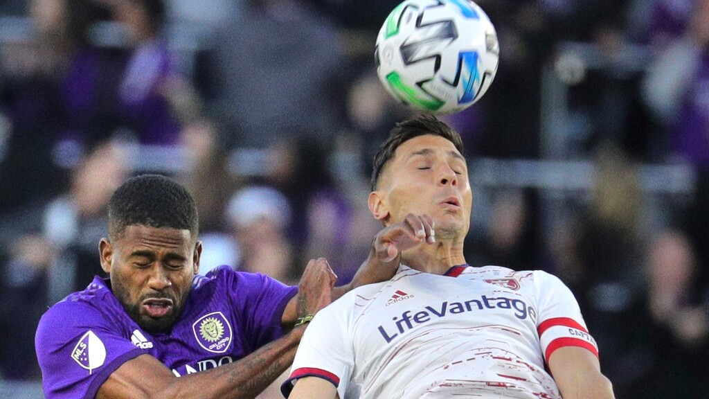Orlando's Ruan, left, and Utah's Damir Kreilach, right, collide on a header during an MLS soccer match in Orlando, Fla., Saturday, Feb. 29, 2020. (Joe Burbank/Orlando Sentinel via AP)