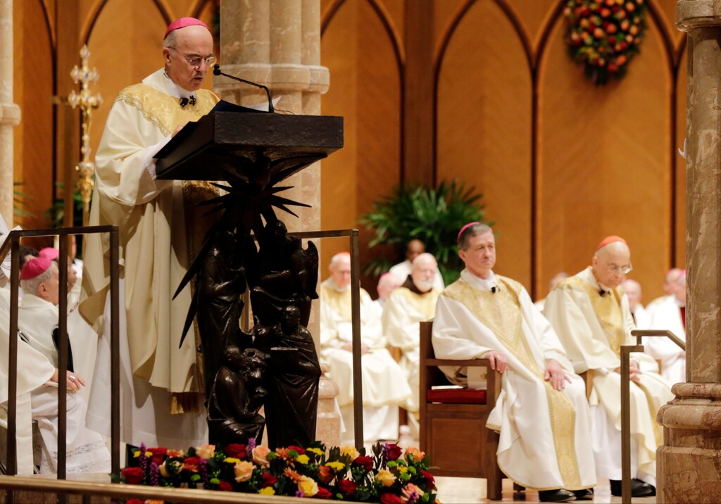 (AP Photo/Charles Rex Arbogast, Pool) In this Nov. 18, 2014, photo, Archbishop Carlo Maria Viganò reads the Apostolic Mandate during the Installation Mass of Archbishop Blase Cupich at Holy Name Cathedral, in Chicago.