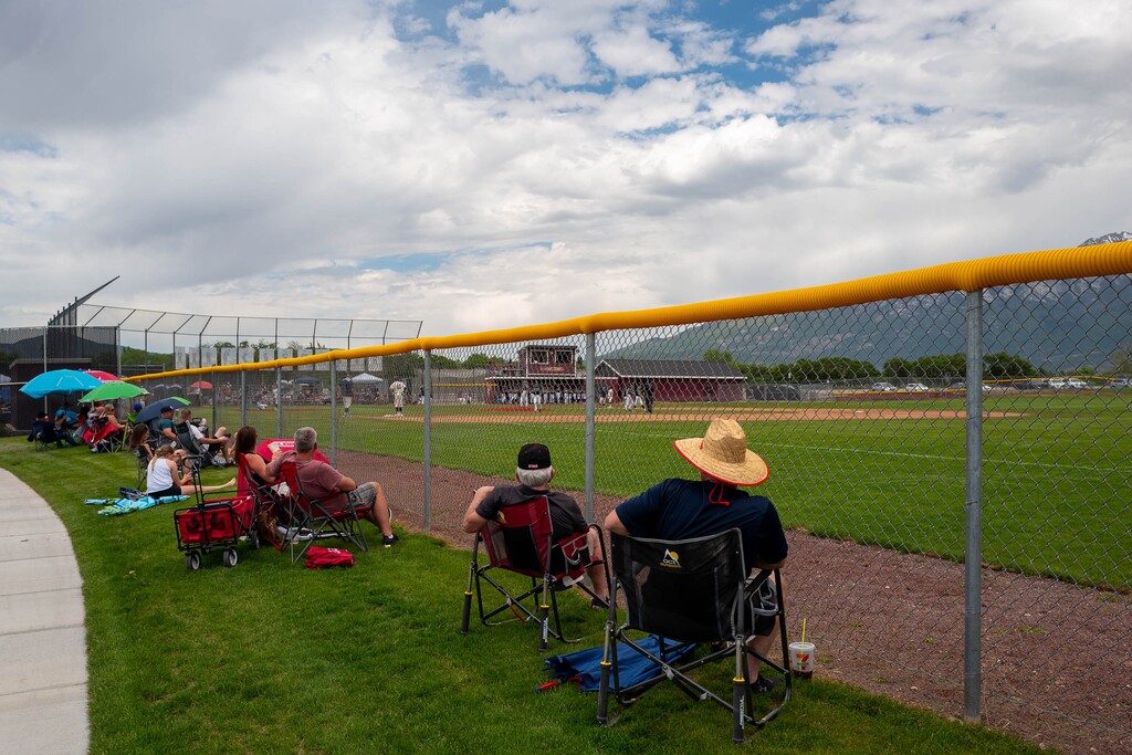(Trent Nelson  |  The Salt Lake Tribune) Fans practice social distancing as Copper Hills faces Syracuse High School in the Last Chance Baseball Tournament at Lone Peak High School in Highland on Friday, May 29, 2020.
