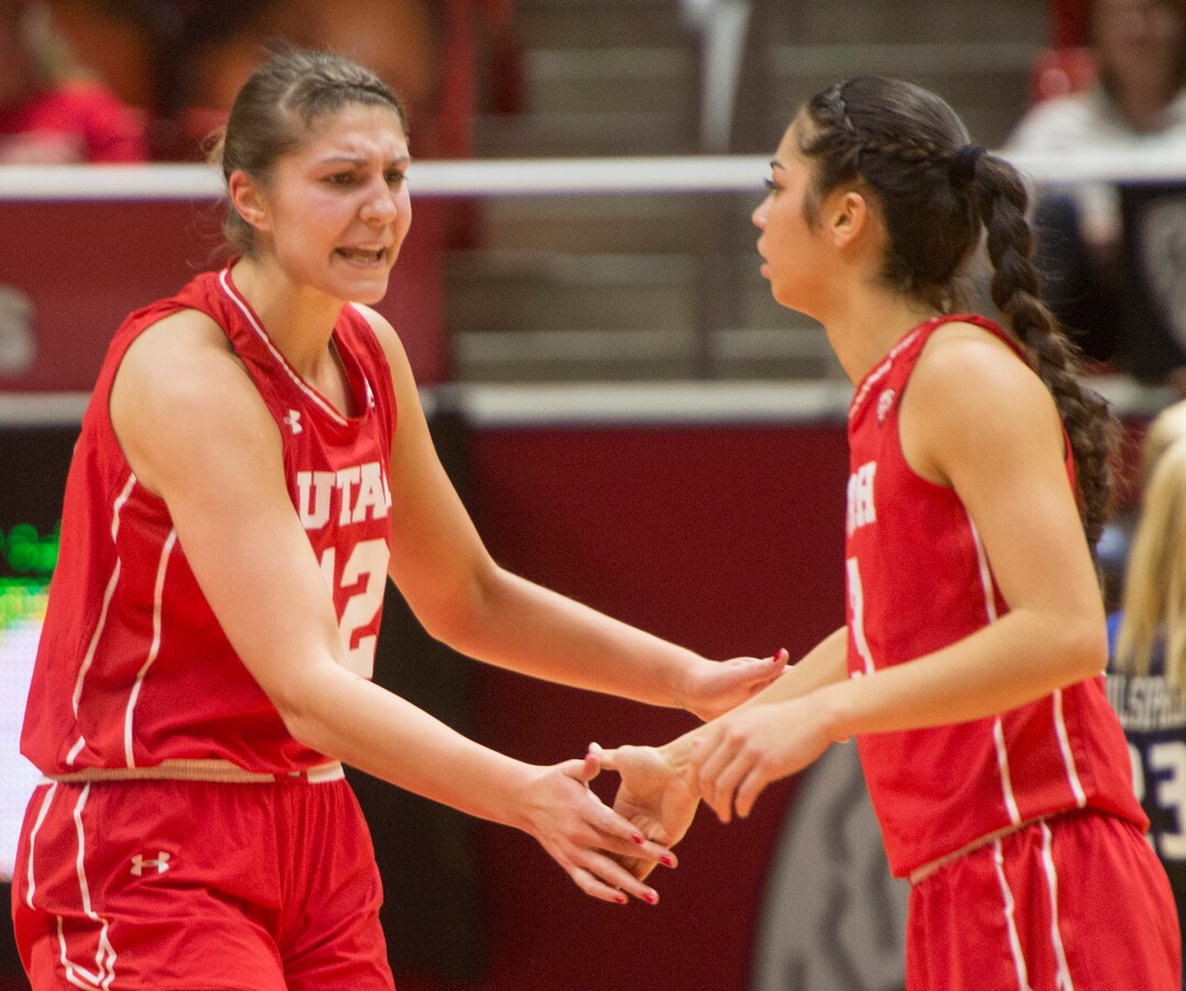 Rick Egan  |  The Salt Lake TribuneUtah Utes forward Emily Potter (12) shouts its  Malia Nawahine (3), after Nawahine hit a 3-point-shot to tie the game, in Basketball action, Brigham Young Cougars vs. the Utah Utes, Saturday, December 10, 2016.