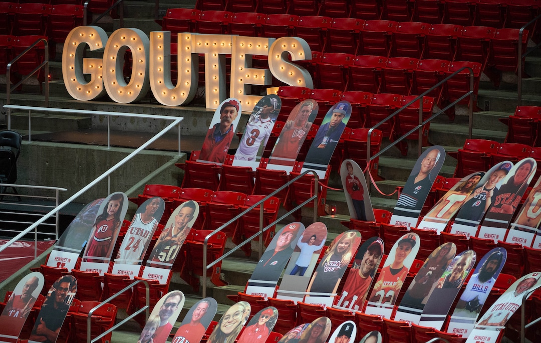 (Francisco Kjolseth  | The Salt Lake Tribune) Photographs and piped in sounds of a crowd fill the void as the Utes host the Stanford Cardinals on Thursday, Jan. 14, 2021 at the Jon M. Huntsman Center in Salt Lake City.
