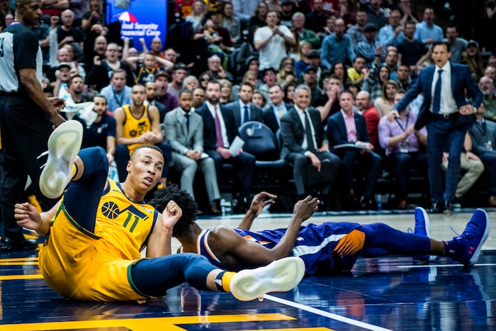 (Chris Detrick  |  The Salt Lake Tribune)  Utah Jazz guard Dante Exum (11) fouls Phoenix Suns guard Josh Jackson (20) during the game at Vivint Smart Home Arena Thursday, March 15, 2018. Utah Jazz defeated Phoenix Suns 116-88.