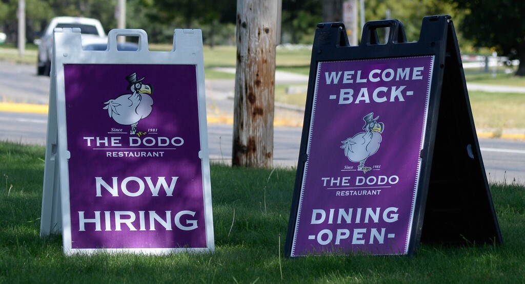 (Francisco Kjolseth  |  Tribune file photo) Help-wanted signs in and around Salt Lake City in July.