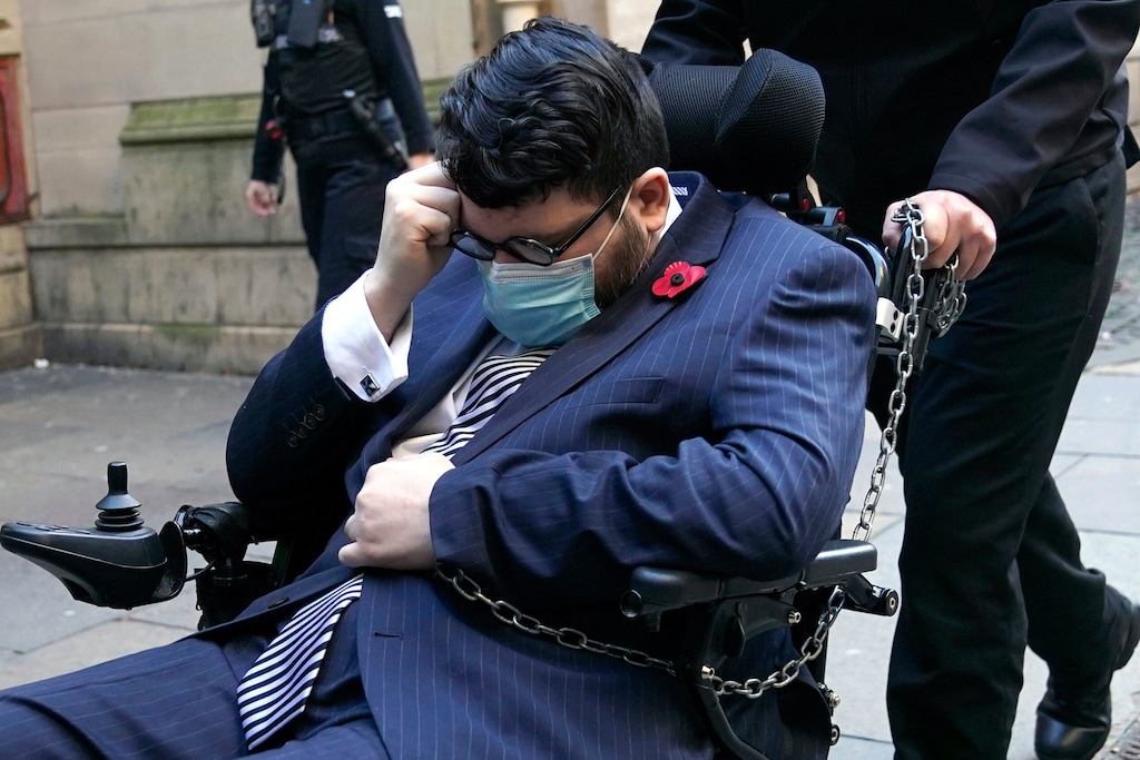 (Jane Barlow | PA via AP) The defendant authorities believe to be Nicholas Rossi arrives at Edinburgh Sheriff And Justice Of The Peace Court for a hearing on his extradition to the US, where he is wanted after allegedly fleeing the country in 2017 to evade charges involving identity theft and fraud, and a 2008 sexual assault charge in Utah. The man, who goes by at least ten other aliases, including Nicholas Alahverdian and Arthur Knight, denies he is Rossi, in Edinburgh, Wednesday Nov. 9, 2022.
