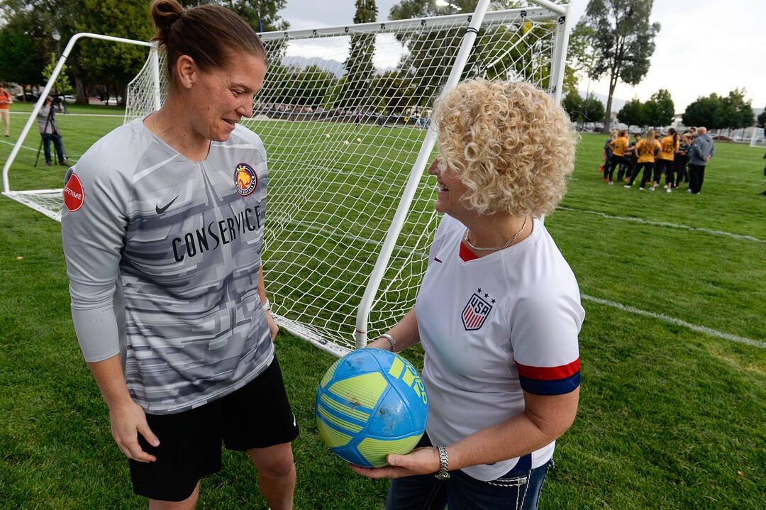(Francisco Kjolseth  |  The Salt Lake Tribune)  Utah Royals FC goalkeeper Nicole Barnhart signs a ball for Mayor Jackie Biskupski following a ceremonial shot attempt by the mayor as Salt Lake CityÕs Parks and Public Lands Division invites the public to attend a jubilee in celebration of the recently completed improvements at Pioneer Park on Tuesday, September 10, 2019.