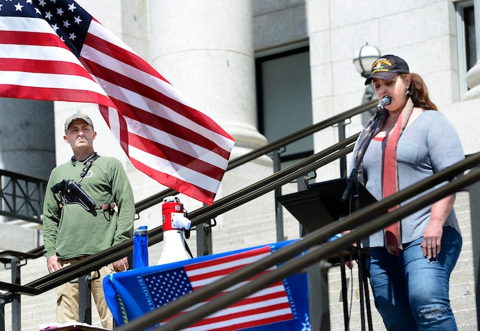 (Scott Sommerdorf | The Salt Lake Tribune)
Steven Lund stood by with a gun strapped to his chest while Villina Greenwell talked about gun control in Australia as a group calling themselves Citizens and Students For Liberty (SFL) gathered at the Utah State Capitol on Saturday to show their support for the Second Amendment, Saturday, April 14, 2018.