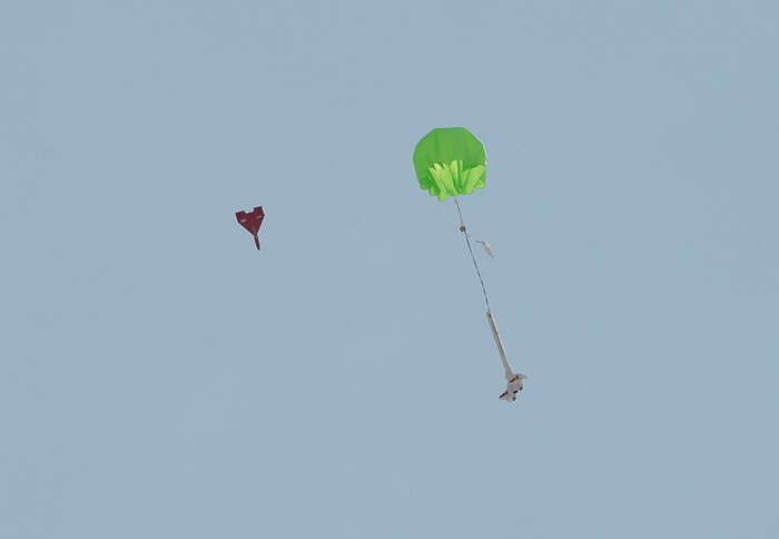 (Scott Sommerdorf   |  The Salt Lake Tribune)   A rocket is brought back down to Earth with a successful parachute deployment as it's glider makes it's flight at HellFire, sponsored by the Utah Rocket Club, Saturday, August 5, 2017.  