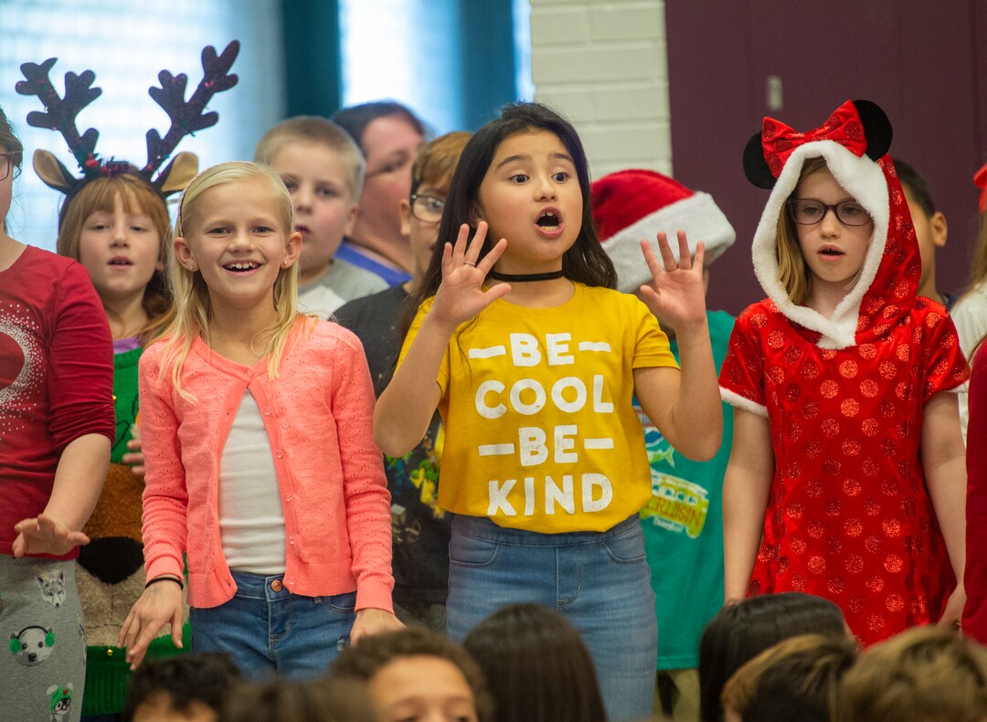 (Rick Egan  |  The Salt Lake Tribune)   Second graders sing during a Christmas assembly, before Ms. Worthington the principal, surprised all 650 students at her school with the gift-wrapped boxes of cereal, at Oquirrh Elementary in West Jordan, Thursday, Dec. 20, 2018.