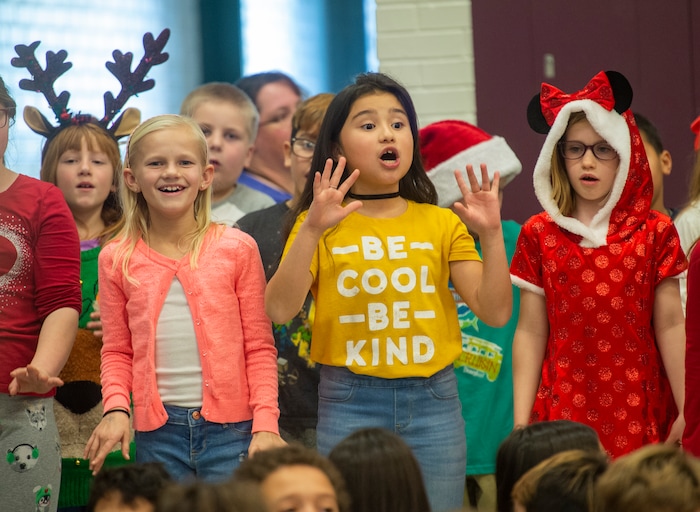 (Rick Egan  |  The Salt Lake Tribune)   Second graders sing during a Christmas assembly, before Ms. Worthington the principal, surprised all 650 students at her school with the gift-wrapped boxes of cereal, at Oquirrh Elementary in West Jordan, Thursday, Dec. 20, 2018.


