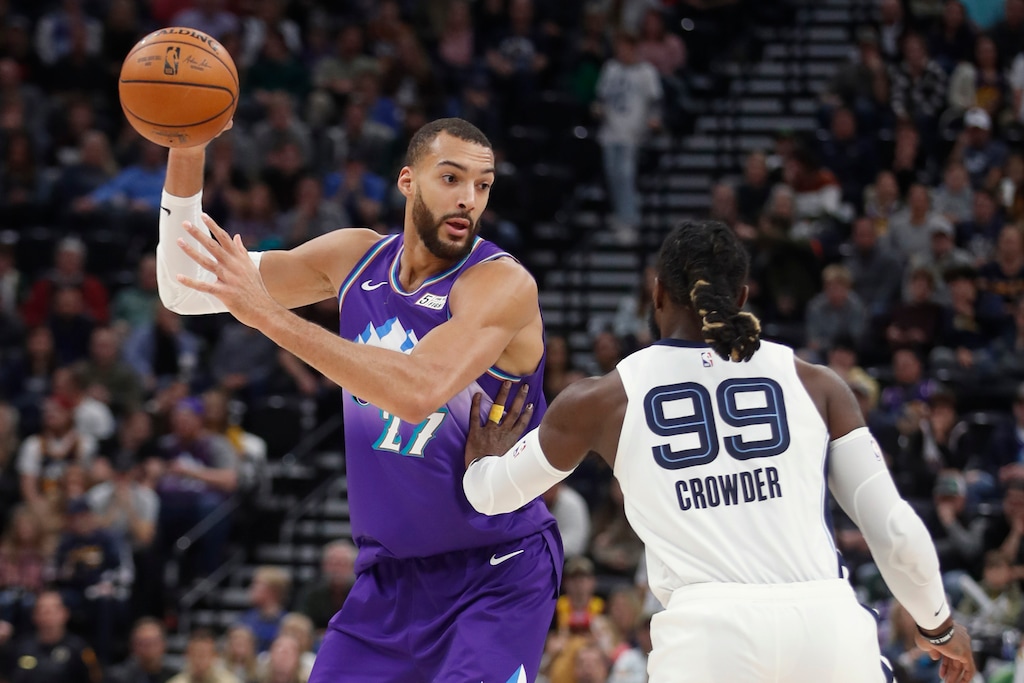 Utah Jazz center Rudy Gobert (27), is defended by Memphis Grizzlies forward Jae Crowder (99) during the first half of an NBA basketball game Saturday, Dec. 7, 2019, in Salt Lake City. (AP Photo/George Frey)