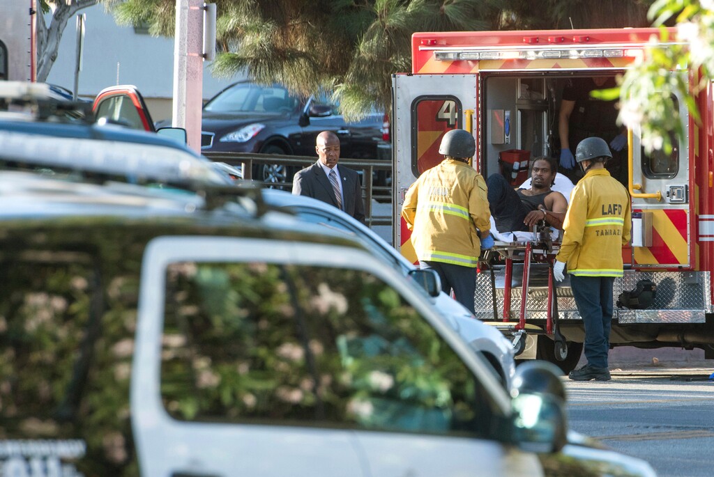Suspect Gene Evin Atkins is arrested after evading police and holding dozens of people hostage inside a Trader Joe's supermarket, Saturday, July 21, 2018, in Los Angeles. (Christian Monterrosa via AP)