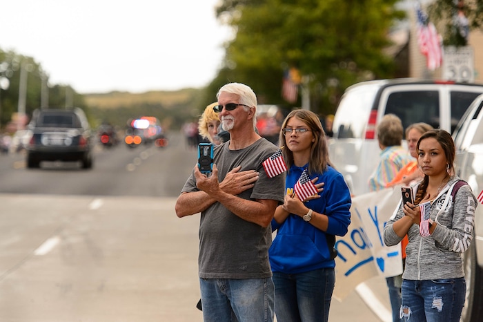 (Trent Nelson | The Salt Lake Tribune)  Crowds line Main Street in Monticello to honor the motorcade of fallen soldier Aaron Butler, who was killed last week in Afghanistan, , Thursday August 24, 2017.