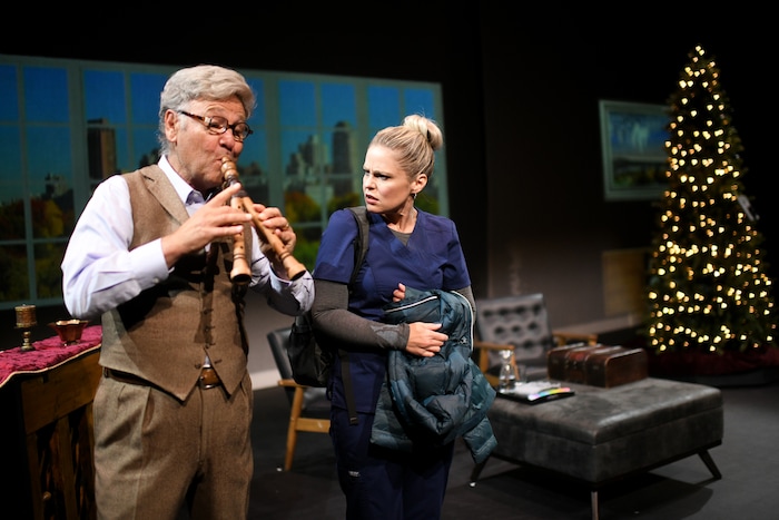 (Photos courtesy of Purdie Distribution) John (Michael McLean, left) plays a tune for Constance (Adrien Swenson), a nurse sent to care for the old man, in the movie version of McLean's "The Forgotten Carols."