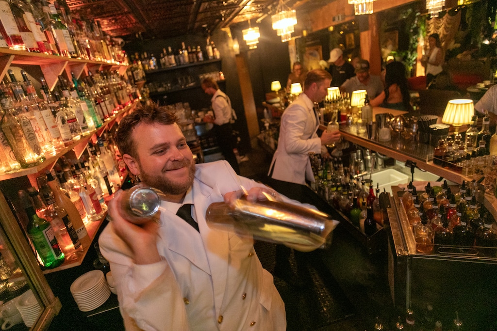 (Jud Burkett | Special to The Tribune) Bartender Alec Kemer shakes cocktails behind the bar at Spiritual Speakeasy in St. George, Friday, Aug. 14, 2026.