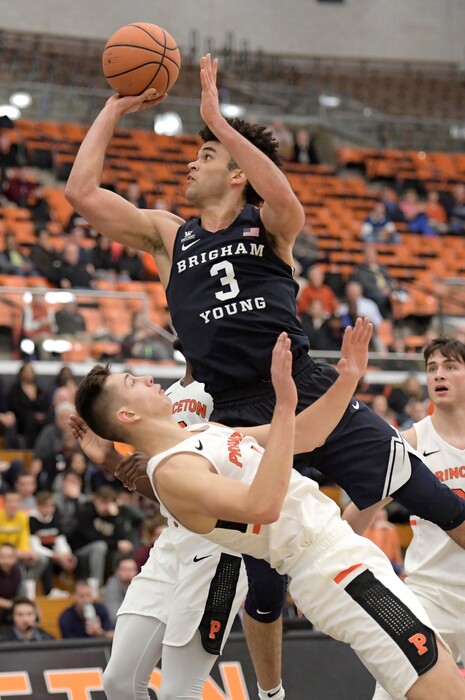 BYU guard Elijah Bryant (3) puts up a shot over Princeton forward Mike LeBlanc during the second half of an NCAA college basketball game Wednesday, Nov. 15, 2017, in Princeton, N.J. BYU defeated Princeton 65-56. (AP Photo/Bill Kostroun)