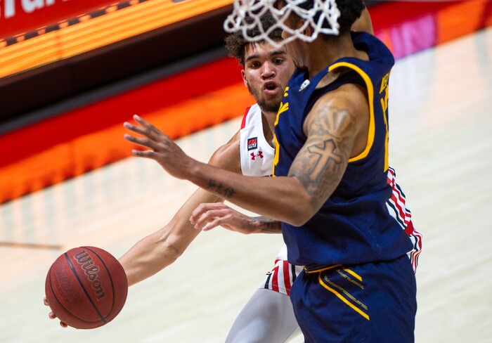 (Rick Egan | The Salt Lake Tribune) Utah Utes forward Timmy Allen (1) goes to the basket as California Golden Bears forward Andre Kelly (22) defends, in PAC12 Basketball action between the Utah Utes and the California Golden Bears, on Wednesday, Jan. 16, 2021.