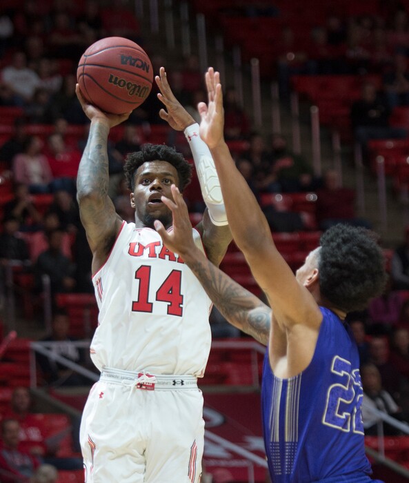 (Rick Egan  |  The Salt Lake Tribune)  Utah Utes guard Vante Hendrix (14) shoots as  Keun Palu-Thompson (22) College of Idaho, defends, in basketball action, between the Utah Utes and the College of Idaho Yotes at the Jon M. Huntsman Center, Thursday, Nov. 1, 2018.