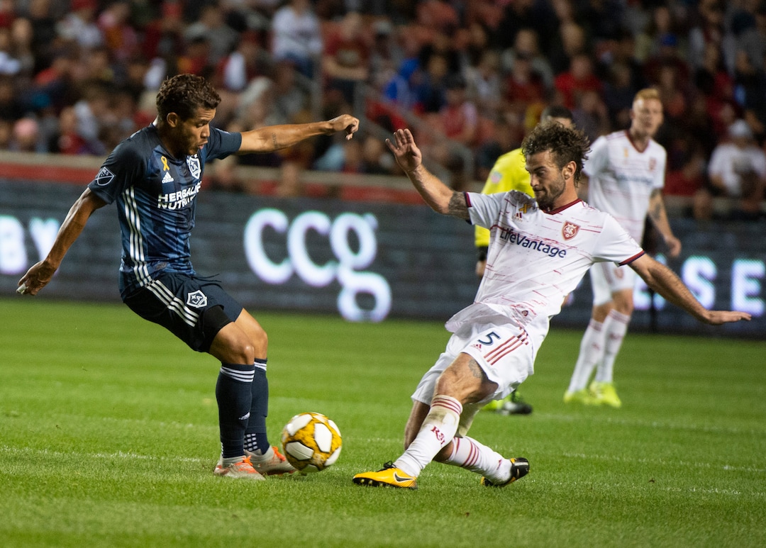 (Rick Egan  |  The Salt Lake Tribune)      Los Angeles Galaxy defender Dave Romney (4) goes after the ball along with Real Salt Lake midfielder Kyle Beckerman (5)), in MLS soccer action between Real Salt Lake and Los Angeles Galaxy at Rio Tinto Stadium, Wednesday, Sept. 25, 2019.