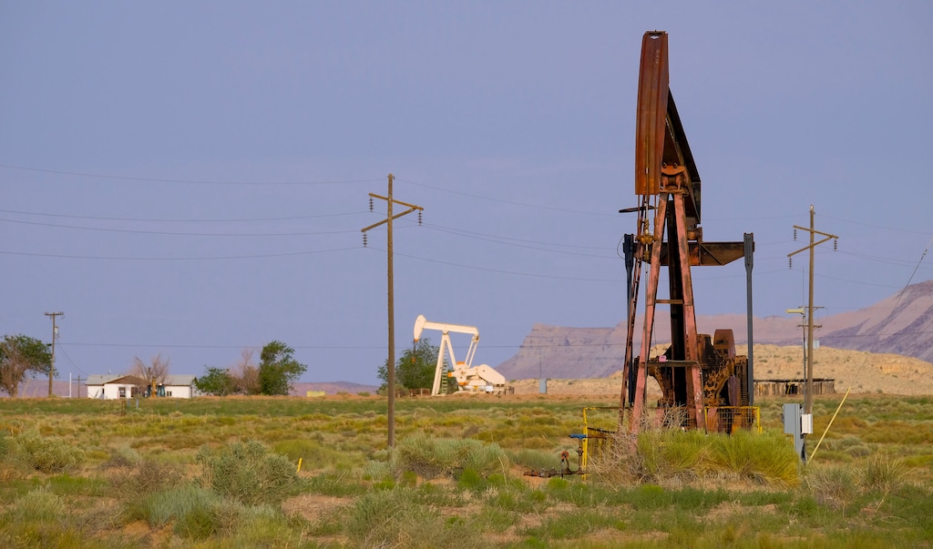 (Leah Hogsten | Tribune file photo) Crude oil pumpjacks, defunct, at right, and fully operational, at left, in San Juan County.